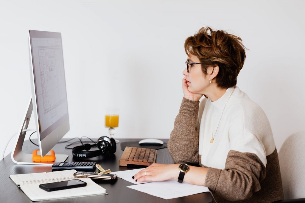 woman using desktop computer